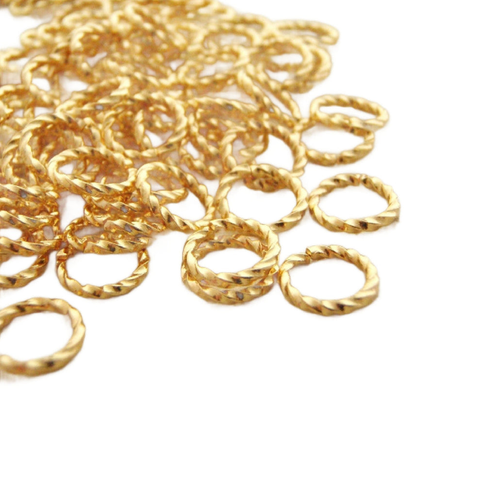 Fancy twisted gold plated jump rings. This gold jump ring is for use in diy jewelry making.