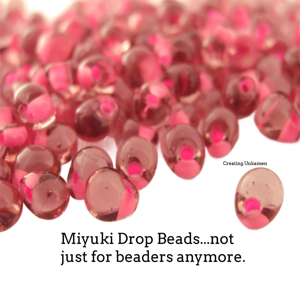 Miyuki DPF-03 Pink Lined Smoky Amethyst Drop Beads - 3mm X 4mm