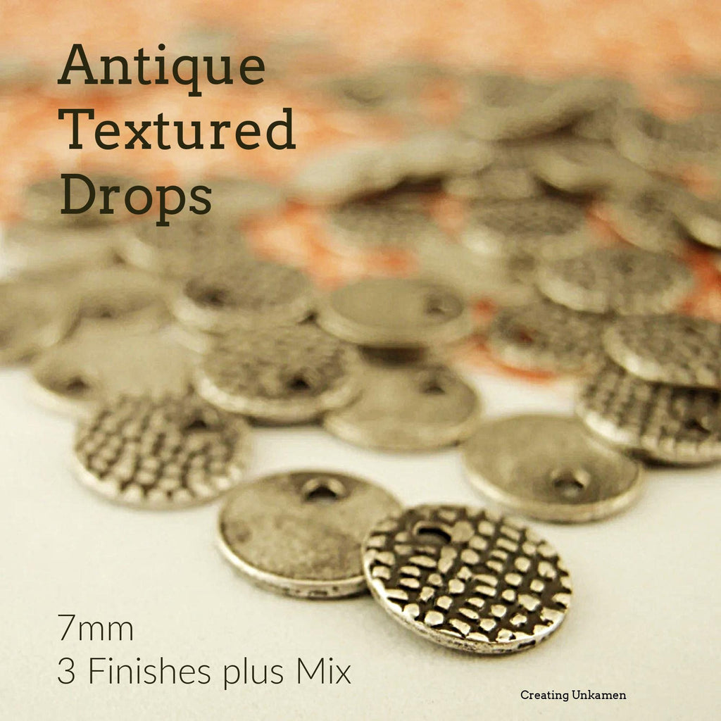 25 Antique Textured Drops - 7mm Charms in Antique Silver, Antique Copper or Antique Gold - 100% Guarantee