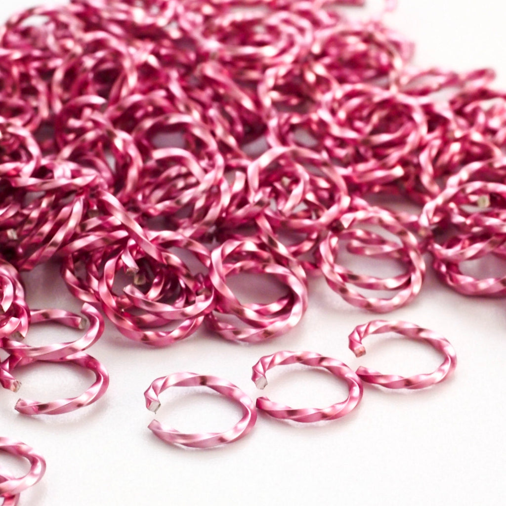100 - 14 gauge Twisted Square Pink Anodized Aluminum Jump Rings  8.8mm ID - 11.8mm OD - 5/16"